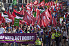 People carry banners and flags during a demonstration ahead of the NATO summit in The Hague, Netherlands, June 22. [AP/YONHAP]