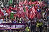 People carry banners and flags during a demonstration ahead of the NATO summit in The Hague, Netherlands, June 22. [AP/YONHAP]
