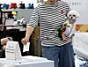 Unleash your civic duty — A voter casts a ballot while holding their dog at a polling station set up inside the Wrestling No.1 Multi-Gym in Busan, on June 3, the day of the 21st presidential election. [NEWS1]