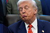 U.S. President Donald Trump listens before signing a spending bill in the Oval Office of the White House on Feb. 3 in Washington. [AP/YONHAP]