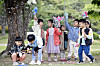Children supervised by the workplace childcare center at Buk District of Gwangju play with bubbles at Chonnam National University. [BUK DISTRICT OFFICE]