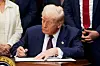 U.S. President Donald Trump signs an executive order to reinstate the Presidential Fitness Test, in the Roosevelt Room at the White House in Washington, July 31. [REUTERS/YONHAP]