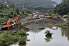 Construction is underway to prepare for an emergency release from the Doam Dam on Namdae Stream in Gangneung, Gangwon, on Sept. 18. [YONHAP]