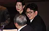 Bang Si-hyuk, chairman of K-pop powerhouse HYBE, talk with other attendants at the 64th general meeting of The Federation of Korean Industries (FKI) at the FKI Tower conference center in western Seoul on Feb. 20. [YONHAP]