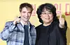 Actor Robert Pattinson, from left, and director Bong Joon-ho pose for photos during a press conference for the science fiction film ″Mickey 17″ held in Yongsan District, central Seoul, on Jan. 20. [NEWS1]