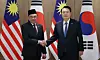 President Yoon Suk Yeol, right, and Malaysian Prime Minister Anwar Ibrahim pose for a photo ahead of their summit held at the presidential office in Yongsan, central Seoul on Monday. [YONHAP]