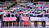 Government officials from the North Gyeongsang provincial government pose for a photo while holding placards with the slogan 'victory in the war against the low birthrate' last year. [GYEONGSANGBUK-DO PROVINCIAL GOVERNMENT]