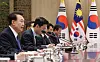 President Yoon Suk Yeol, far left, speaks during a summit with Malaysian Prime Minister Anwar Ibrahim at the presidential office in Yongsan, central Seoul on Monday. [YONHAP]