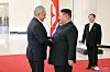 This file photo, carried by North Korea's official Korean Central News Agency on March 22, shows the North's leader Kim Jong-un, right, shaking hands with Sergei Shoigu, secretary of Russia's Security Council, in Pyongyang the previous day. [KOREAN CENTRAL NEWS AGENCY]