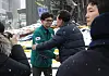 President Yoon Suk Yeol, right, greets People Power Party interim leader Han Dong-hoon during a visit to check on the site of a fire at a traditional market in Seocheon, South Chungcheong, on Tuesday. [JOINT PRESS CORPS]