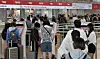 Travelers wait in line to check in for flights bound for Japan at the Incheon International Airport on July 7, 2024. [NEWS1]