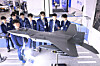Students from Gyeongbuk Aviation High School examine a model of the next-generation KF-21 fighter jet at the Air Force booth during the 2025 Korea Future Airport Expo in Daegu, on Nov. 26. [NEWS1]