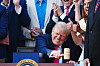 President Donald Trump strikes a gavel from Speaker of the House Mike Johnson, R-LA, after signing a new tax and immigration bill during a ceremony at the White House in Washington DC on July 4. [UPI/YONHAP]