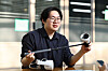 Hanyang University Erica Campus' in-campus startup iLLisoft CEO Ahn Ho-jun introduces a sports device designed to assist visually impaired people on the university's campus in Ansan, Gyeonggi, on Nov. 18. [JOONGANG ILBO]