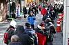 People wait in line for free meals at Tapgol Park in Jongno District, central Seoul, on Dec. 24, 2024. [YONHAP]
