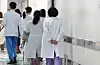 Medical staff walk inside Seoul National University Hospital in Jongno District, central Seoul on Feb. 25. [YONHAP]