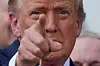 U.S. President Donald Trump gestures after signing a sweeping spending and tax legislation at the White House in Washington on July 4. [REUTERS/YONHAP]