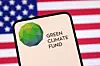Green Climate Fund logo and the U.S. flag are seen in this illustration taken on April 23, 2025. [REUTERS/YONHAP]