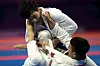 Korea's Joo Seong-hyeon defeats Mongolia's Tuvdentarvaa Choijamts to take bronze in the men's ju-jitsu -69 kilograms contest on Thursday. [REUTERS/YONHAP]
