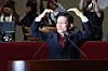 People Power Party (PPP) presidential candidate Kim Moon-soo makes a heart before his speech in the National Assembly’s general meeting room in Yeouido, western Seoul, on May 9. [NEWS1]