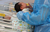 A newborn baby is seen being tended to by a nurse at a hospital in Goyang, Gyeonggi, on Nov. 26, 2025. [YONHAP]