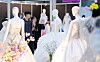 Engaged couples look at wedding dresses at a wedding exposition in Coex, southern Seoul, on July 6. [NEWS1]