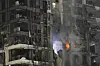 Fire and smoke rises from a destroyed building that was hit by a missile fired from Iran, in Tel Aviv, Israel on June 13. [AP/YONHAP]