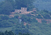 A North Korean loudspeaker used for broadcasts toward the South is seen near a guard post in the North, as observed from a border area in Gyeonggi on June 13. [JOINT PRESS CORPS]
