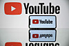 A picture taken on Oct. 5, 2021 shows the logo of Youtube social media displayed by a by a tablet and a smartphone [AFP/YONHAP]