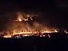 A wildfire that broke out the day before in Sicheon-myeon, Sancheong County, in South Gyeongsang, blazes through the night on March 22. [NEWS1]