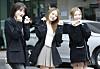 Three members of girl group Billlie pose for photos after voting for the general election on April 5. [IST ENTERTAINMENT]