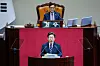President Lee Jae Myung, center front, gives his first policy speech with Woo Won-shik, the parliamentary speaker, looking on, at the National Assembly in Yeouido, western Seoul, on June 26. [JOINT PRESS CORPS]