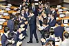 President Lee Jae Myung, center, greets ruling Democratic Party lawmakers as he enters the chamber to give a parliamentary address on the extra budget at the National Assembly in Yeouido, western Seoul, on June 26. [JOINT PRESS CORPS]