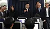 President Lee Jae Myung, center, chats with reporters after the G7 summit in Canada on Air Force One en route to Seoul on June 18. [JOINT PRESS CORPS]