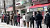 People stand in a queue to buy lottery tickets in Seoul. [NEWS1]