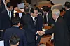 President Lee Jae Myung greets People Power Party lawmakers after delivering his first policy speech at the National Assembly in Yeouido, Seoul, on June 26, following the government's submission of its second supplementary budget proposal. [JOINT PRESS CORPS]