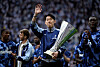 Tottenham Hotspur captain Son Heung-min waves to fans whilst holding the Europa League trophy during the lap of appreciation at Tottenham Hotspur Stadium in London on May 25. [REUTERS/YONHAP]