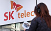 A pedestrian walks by an SK Telecom store in Seoul on Nov. 21, 2025. [NEWS1]