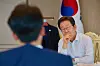 President Lee Jae Myung speaks to Prime Minister Kim Min-seok at the presidential office building in Yongsan District, central Seoul, on July 28. [PRESIDENTIAL OFFICE]