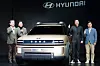 Hyundai Motor President and CEO, Chang Jae-hoon, left, and Lee Sang-yup, Executive Vice President and Head of Hyundai and Genesis Global Design Center, third from left, pose for the camera with the Initium hydrogen fuel cell electric vehicle concept on Thursday. [CHO YONG-JUN]