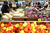 Customers pick out vegetables at a supermarket in Seoul on July 6. [YONHAP]