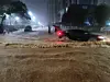 Passersby and vehicles navigate a road submerged by heavy rain in Muan, South Jeolla, on Aug. 3. [NEWS1]