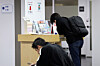 Young job seekers are seen filling out forms before a counseling session at an employment welfare center in Mapo District, western Seoul, on Oct. 17. [NEWS1]