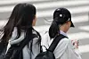 A student uses a smartphone after school at a middle school in Seoul on Nov. 4, 2024. [YONHAP]