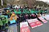 Anti-Thaad activists and local residents sit down on the Jinbat Bridge in Soseong-ri, Chojeon-myeon, Seongju County, North Gyeongsang, on the morning of April 12, 2018, to block access. [NEWS1]
