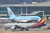 Korean Air and Asiana Airlines' planes are stationed at Incheon International Airport. [YONHAP]