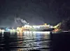 The Queen Jenuvia II, a large passenger ship that ran aground on Jokdo, an uninhabited island in Shinan County, South Jeolla, on Nov. 19, is being towed away by the Coast Guard in the early hours of Nov. 20. [MOKPO COAST GUARD]
