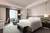 Bedroom of a suite at the Courtyard by Marriott Taipei Downtown [COURTYARD BY MARRIOTT TAIPEI DOWNTOWN]