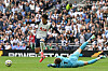 Tottenham Hotspur captain Son Heung-min, left, tries to take the ball around Brentford goalkeeper Mark Flekken during a Premier League match at Tottenham Hotspur Stadium in London on Saturday. [AFP/YONHAP]