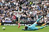 Tottenham Hotspur captain Son Heung-min, left, tries to take the ball around Brentford goalkeeper Mark Flekken during a Premier League match at Tottenham Hotspur Stadium in London on Saturday. [AFP/YONHAP]